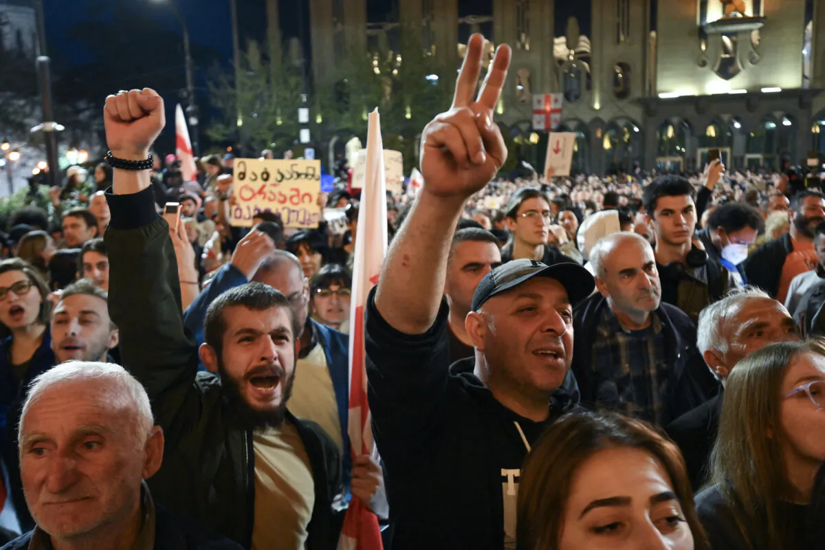 Georgian pro-democracy groups activists react as they protest against a repressive "foreign influence" bill outside the parliament in Tbilisi, Georgia, on April 15, 2024. (Vano Shlamov/AFP)