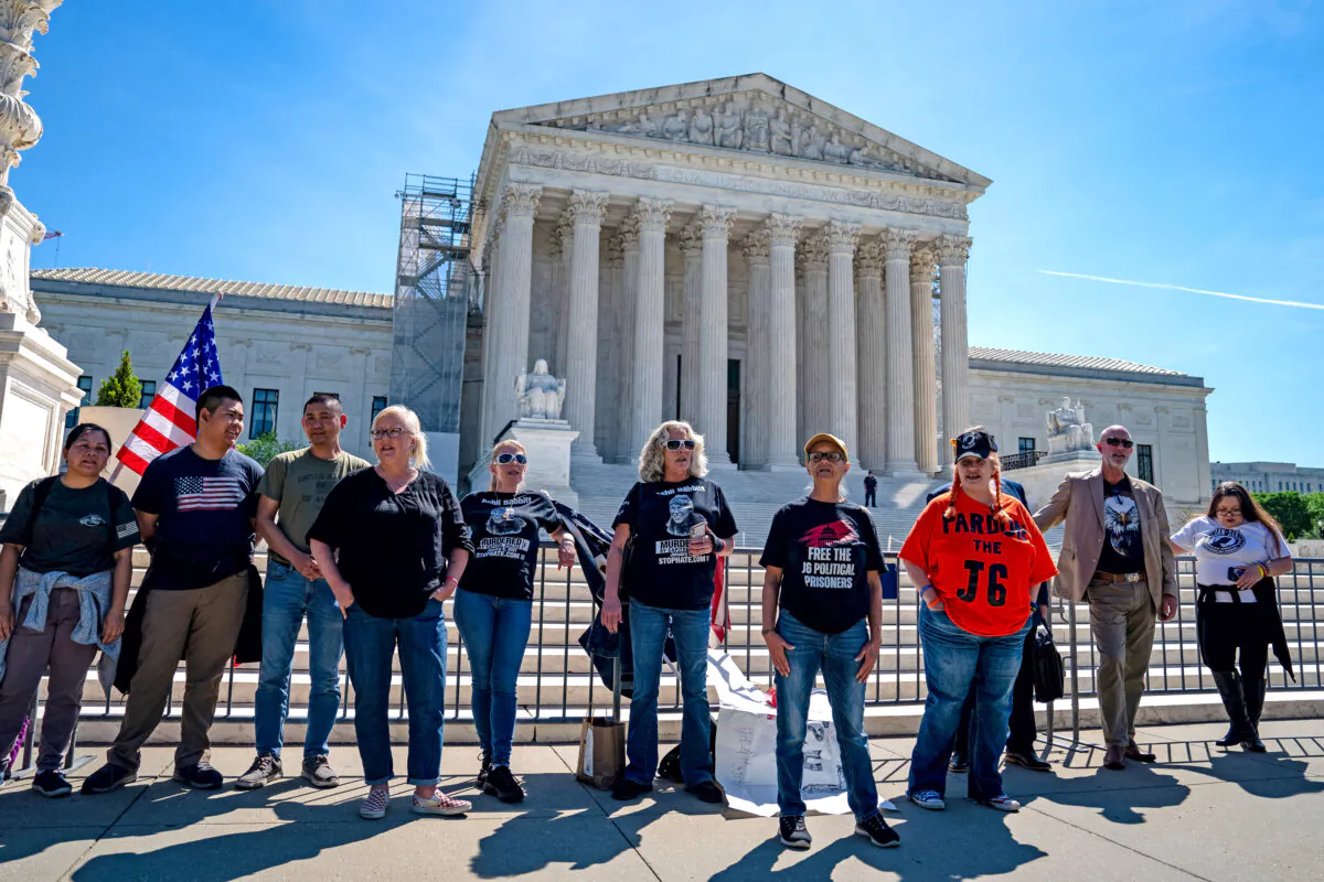 Supporters of Jan. 6 defendants including Micki Witthoeft, the mother of slain Trump supporter Ashli Babbitt, stand outside of the Supreme Court building in Washington on April 16, 2024. (Kent Nishimura/Getty Images)
