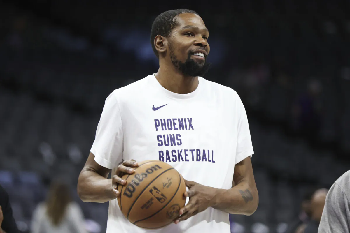Kevin Durant, who could become the first men's basketball player to win four Olympic gold medals, gestures during warmups before a game in Sacramento, Calif., on April 12, 2024. (Benjamin Fanjoy/AP Photo)
