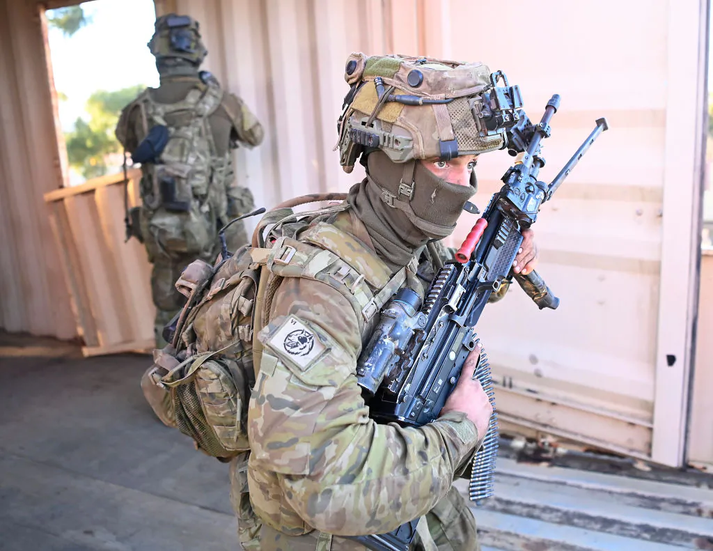 Australian soldiers from 6 RAR (Royal Australian Regiment) take part in an urban assault in Townsville, Australia on June 30, 2023. (Ian Hitchcock/Getty Images)