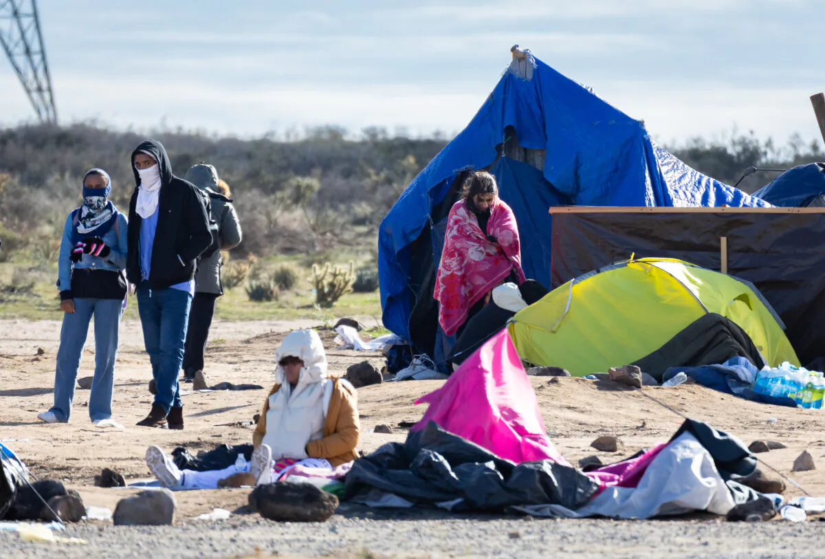 Illegal immigrants at an encampment after crossing the United States border in Jacoumba, Calif., on Feb. 3, 2024. (John Fredricks/The Epoch Times)