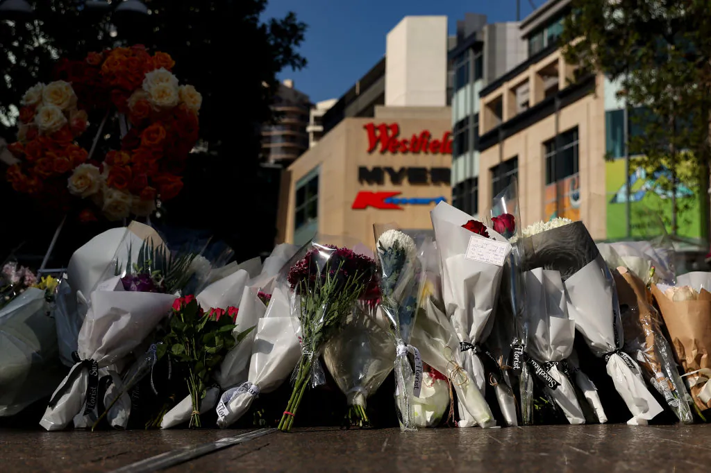 Flowers are placed outside Westfield Shopping mall in honour of the victims on April 16, 2024 in Bondi Junction, Australia. (Photo by Brendon Thorne/Getty Images)