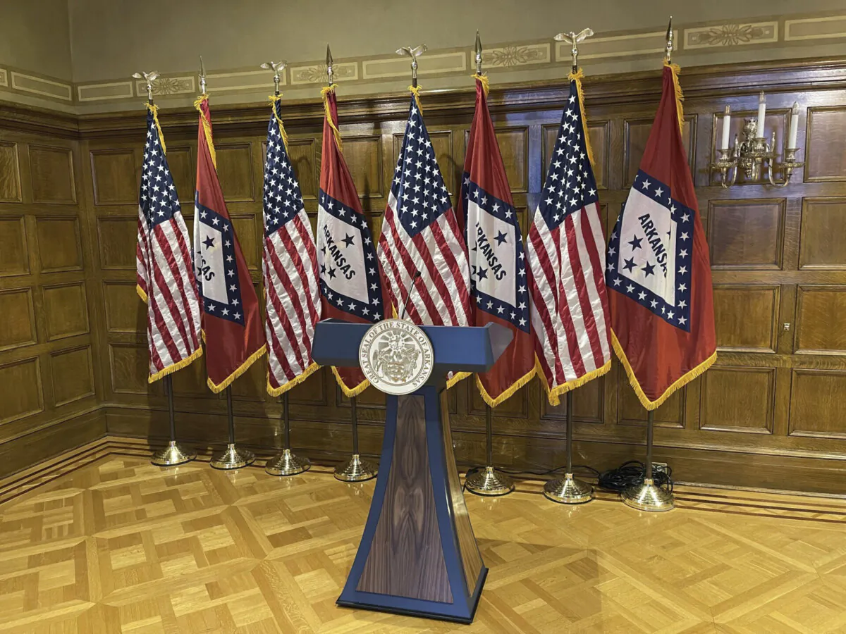 A blue and wood-paneled lectern sits in the governor's conference room at the Arkansas State Capitol on Tuesday, April 16, 2024. The purchase of the $19,000 lectern has sparked controversy. (AP Photo/Andrew DeMillo)