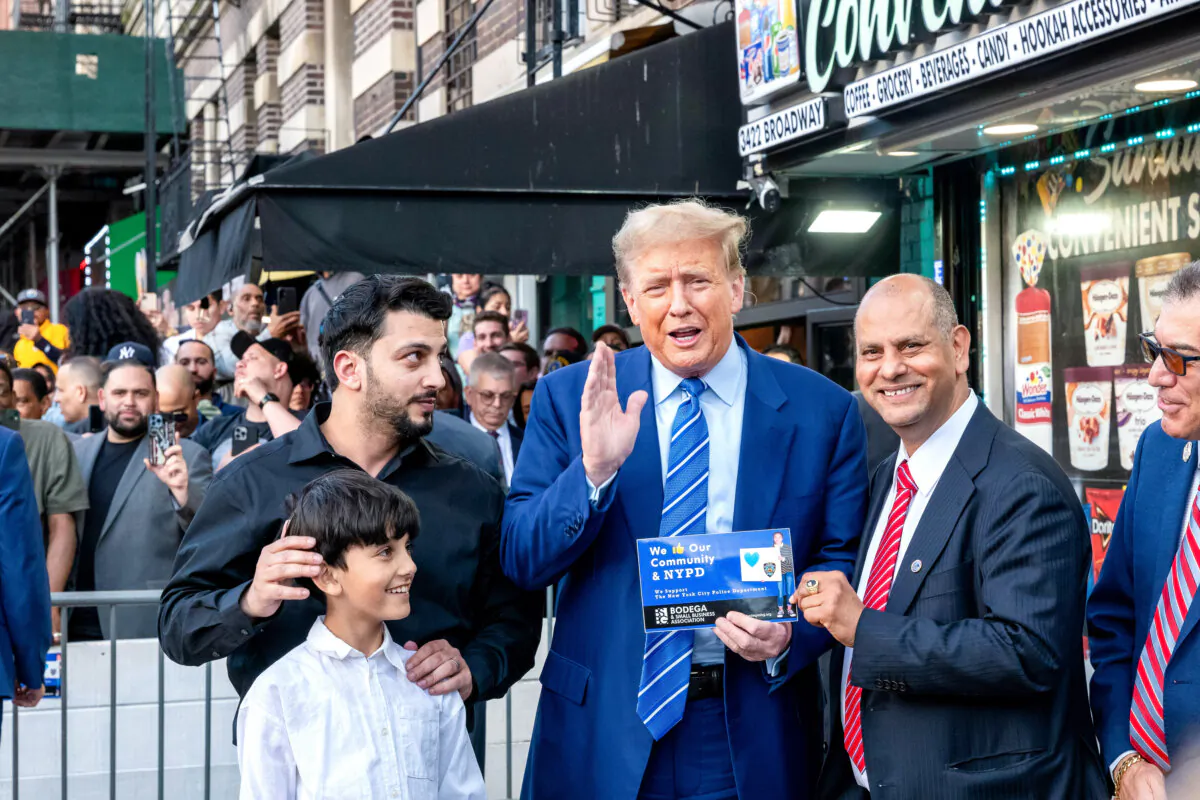 Former President Donald Trump stands with local politicians and bodega workers as he visits a bodega store in upper Manhattan in New York on April 16, 2024. (Spencer Platt/Getty Images)