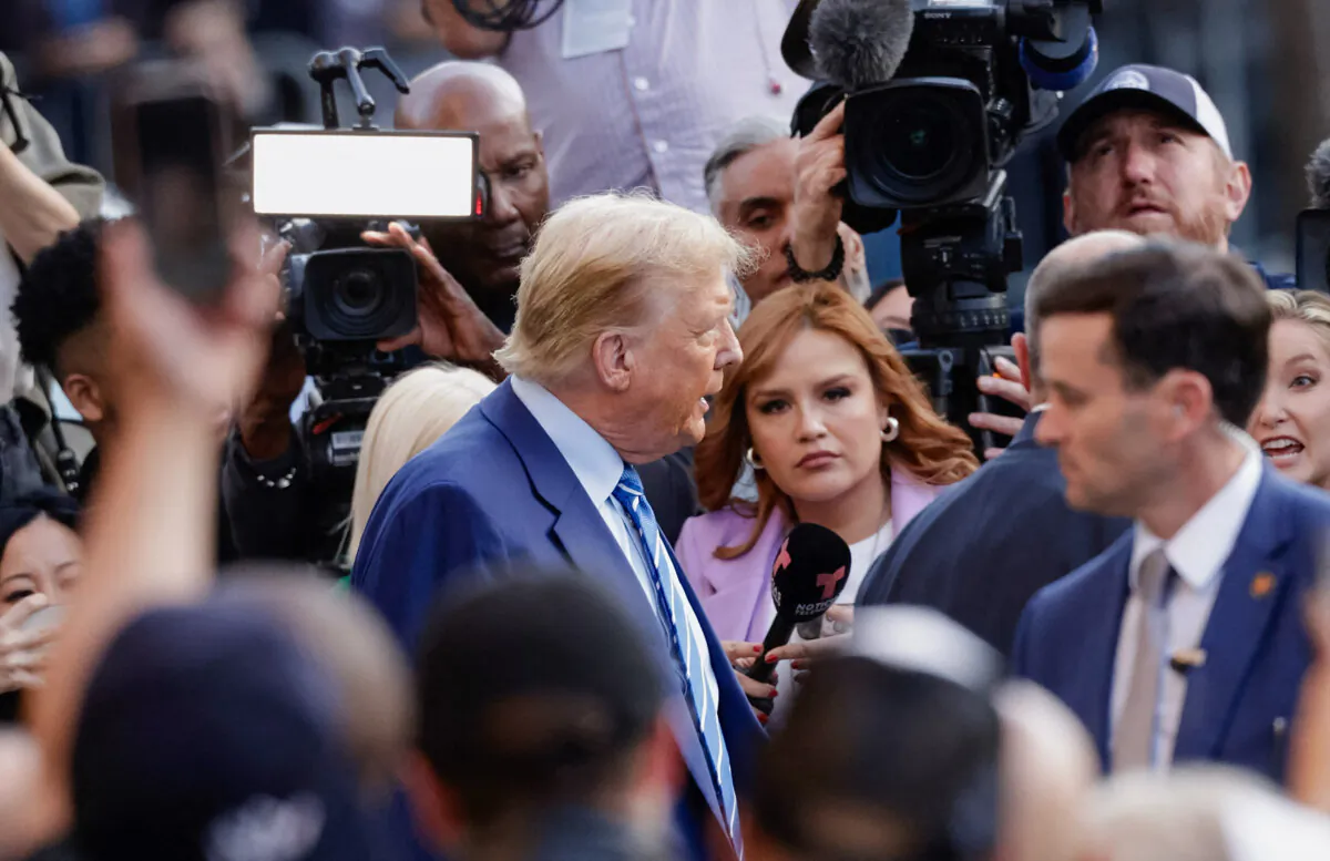 Former US President Donald Trump walks out of a Sanaa convenient store in a Harlem neighborhood after spending his second day of his trial for allegedly covering up hush money payments linked to extramarital affairs, at the Manhattan Criminal Court on April 16, 2024. (Photo by Kena Betancur/AFP via Getty Images)