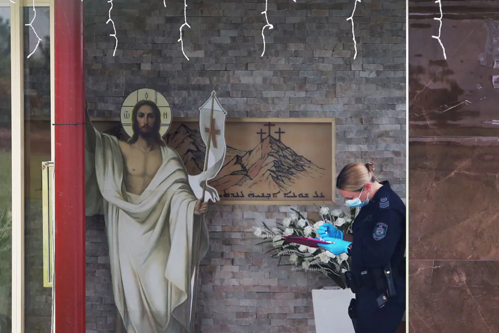 A member of NSW Forensic police is seen at Christ The Good Shepherd Church in the suburb of Wakeley on April 16, 2024 in Sydney, Australia. (Photo by Lisa Maree Williams/Getty Images)