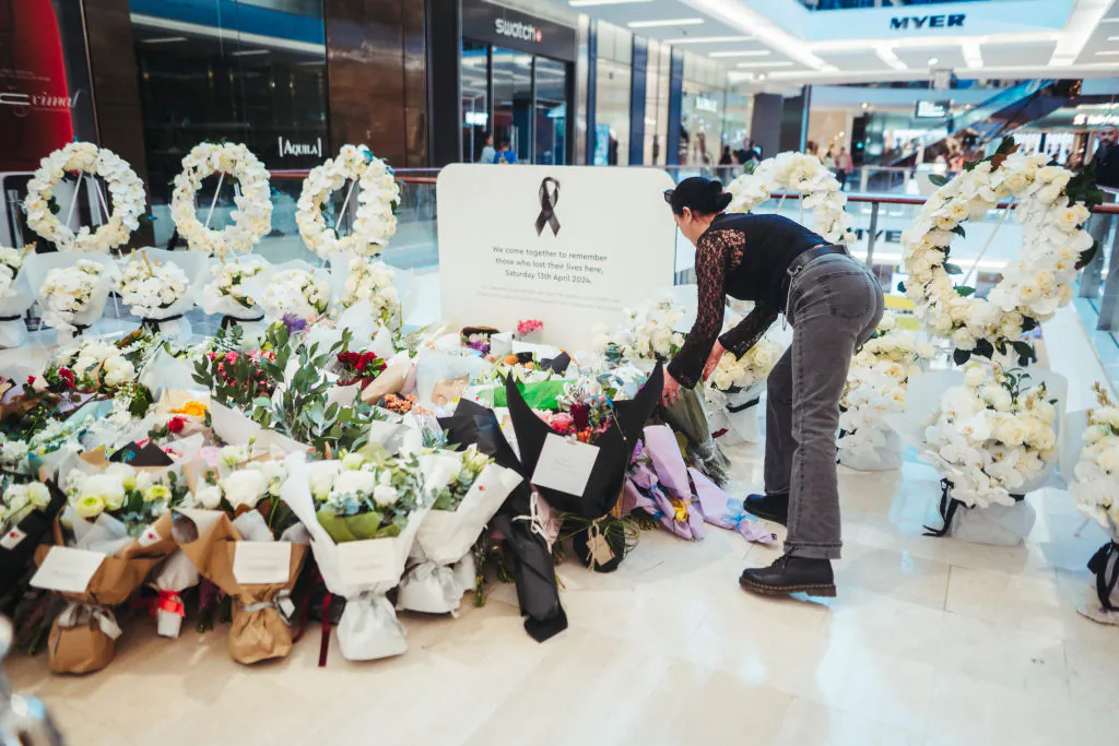 Members of the public pay their respects at the Westfield Bondi Junction shopping centre during a day of reflection in Bondi Junction, Australia, on April 18, 2024. (Dion Georgopoulos - Pool/Getty Images)