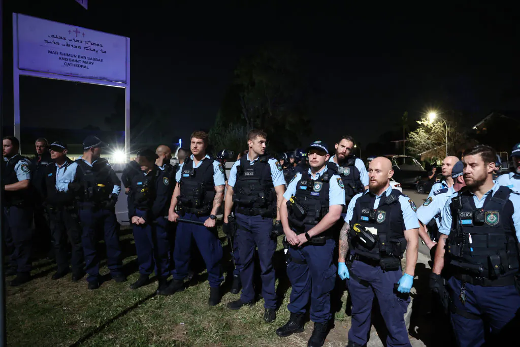 New South Wales police guard the perimeter of the Christ the Good Shepherd Church in Sydney's western suburb of Wakeley on April 15, 2024, after several people were stabbed in the church premises. Australian police arrested a man after several people were stabbed at a church in Sydney on April 15 and emergency services said four people were being treated for non-life threatening injuries. (David Gray/Getty Images)