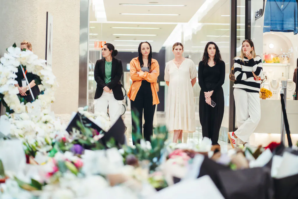 Members of the public pay their respects at the Westfield Bondi Junction shopping centre during a day of reflection in Sydney, Australia, on April 18, 2024. (Photo by Dion Georgopoulos - Pool/Getty Images)