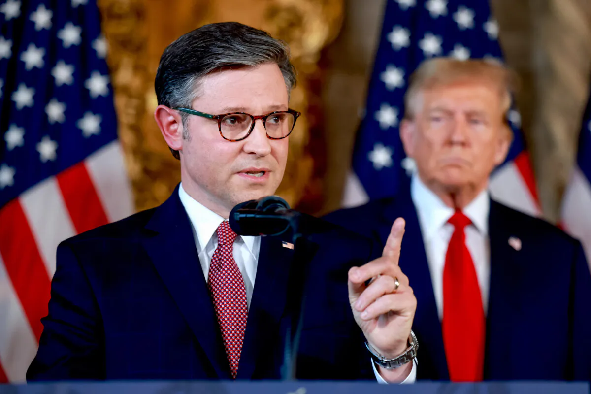 Republican presidential candidate former President Donald Trump listens as Speaker of the House Mike Johnson (R-La.) speaks during a press conference at President Trump's Mar-a-Lago estate in Palm Beach, Fla., on April 12, 2024. (Joe Raedle/Getty Images)