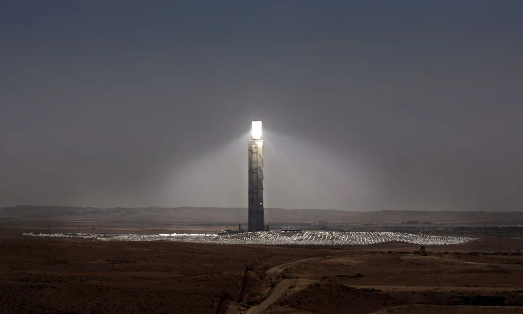 Sunlight is reflecting on the mirrors placed on the top of the Ashalim solar tower near the southern Israeli kibbutz of Ashalim in the Negev desert on April 28, 2019. (Thomas Coex/AFP via Getty Images)