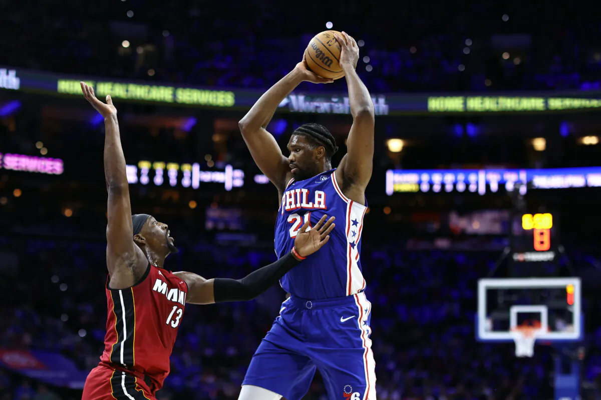 Bam Adebayo #13 of the Miami Heat guards Joel Embiid #21 of the Philadelphia 76ers during the first quarter of the Eastern Conference Play-In Tournament at the Wells Fargo Center in Philadelphia, Pa., on April 17, 2024. (Tim Nwachukwu/Getty Images)