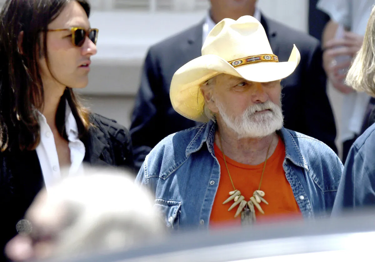 Dickey Betts, a founding member of the Allman Brothers Band, exits the funeral of Gregg Allman at Snow's Memorial Chapel in Macon, Ga., on June 3, 2017. (Jason Vorhees/The Macon Telegraph via AP, File)