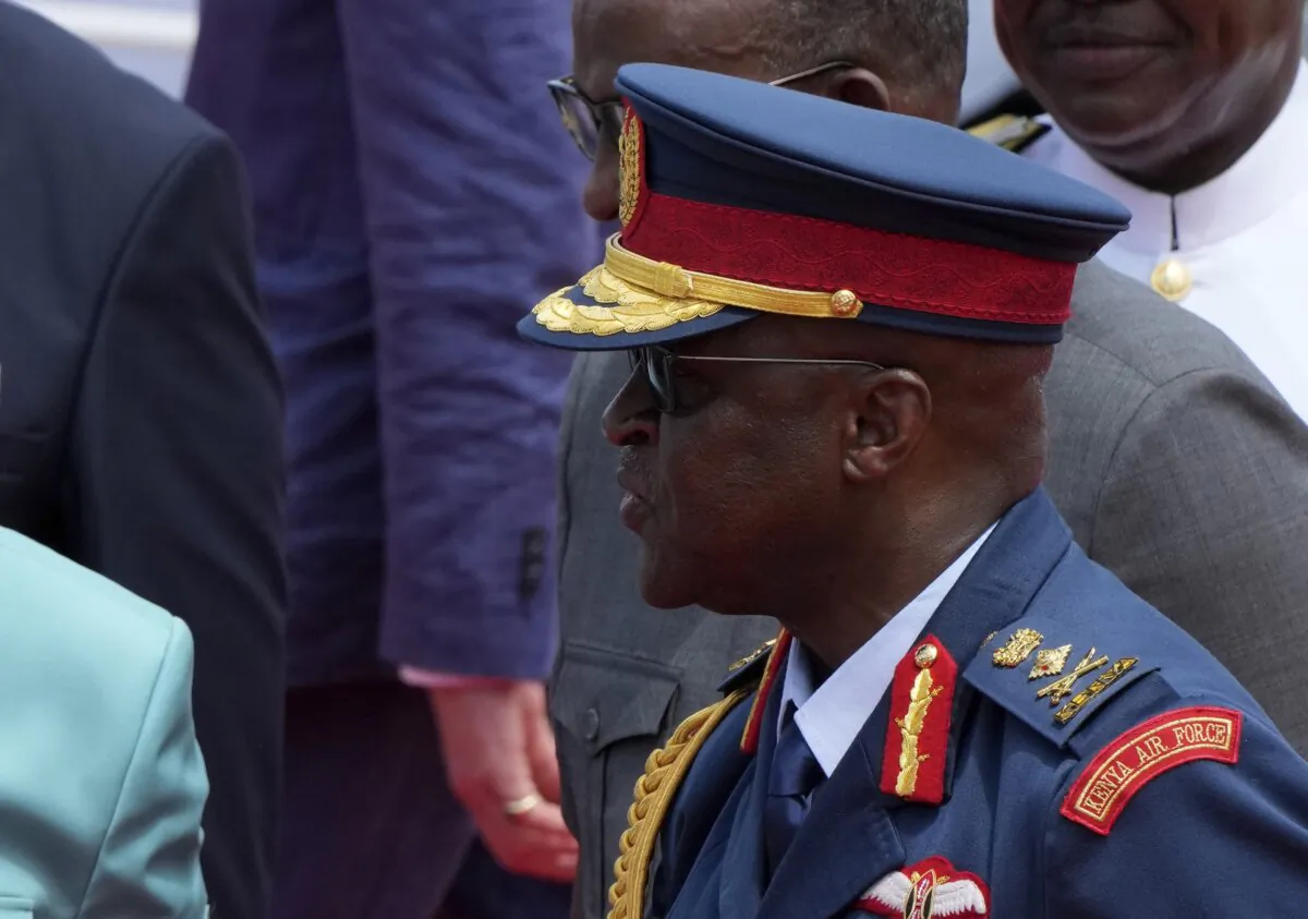 Kenya's military chief General Francis Ogolla (R) shakes hand with Britain's King Charles III (L) and Kenya's President William Ruto (C) as they attend a military welcome ceremony during Charles' visit at the Mtongwe Naval Base in Mombasa, Kenya, on Nov. 2, 2023. (Brian Inganga/AP Photo)