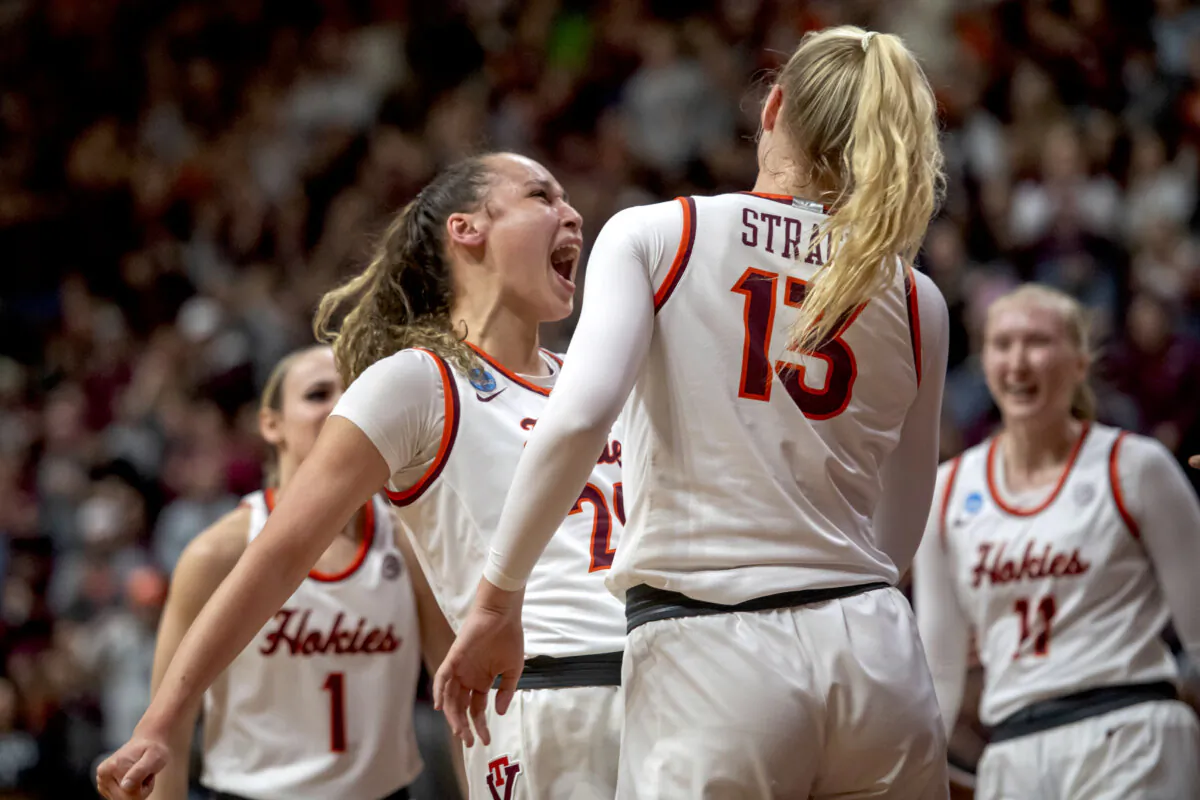 Virginia Tech's Olivia Summiel (L) celebrates with Clara Strack (13) during the first half of a second-round college basketball game against Baylor in the women's NCAA Tournament in Blacksburg, Va., on March 24, 2024. (Robert Simmons/AP Photo)