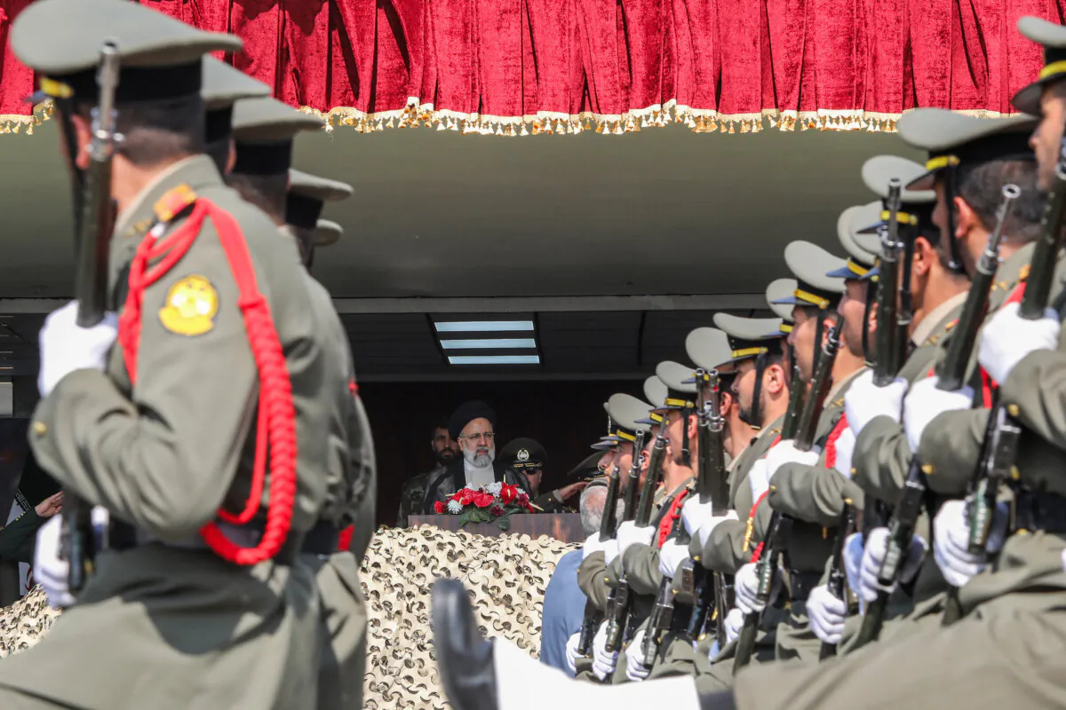 Iranian soldiers march past Iranian President Ebrahim Raisi during a military parade as part of a ceremony marking the country’s annual Army Day, in Tehran, Iran, on April 17, 2024. (Atta Kenare/AFP/Getty Images)