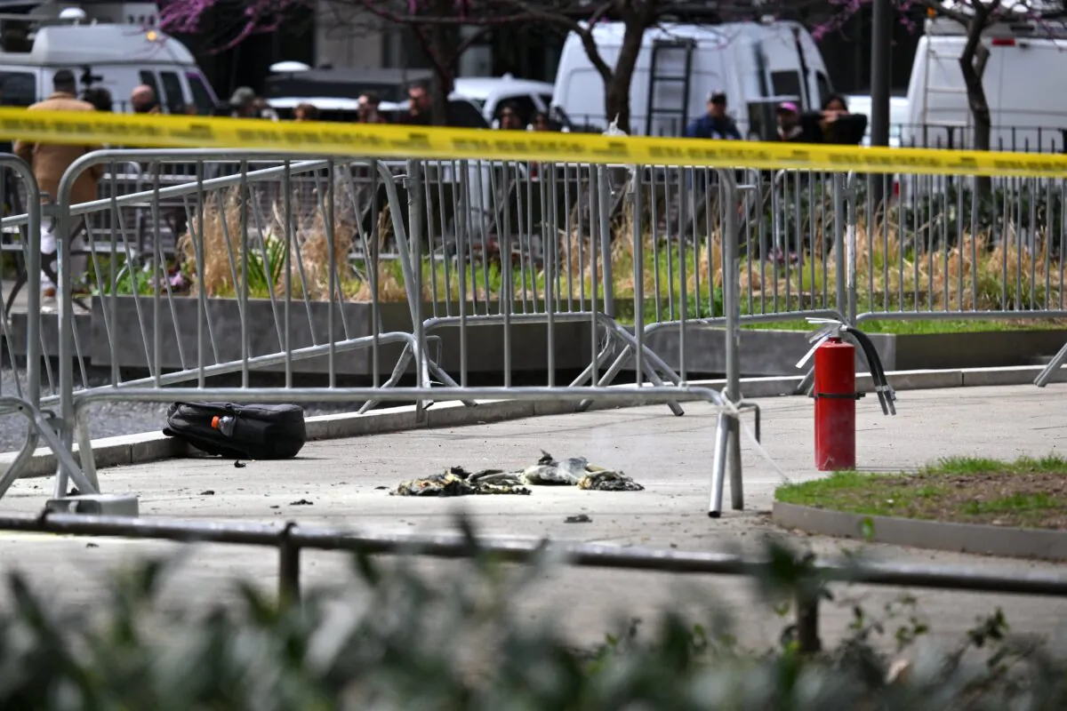 Fire extinguishers are left at the park across from Manhattan Criminal Court in New York City after a man reportedly set himself on fire during the trial of former President Donald Trump, in New York City on April 19, 2024. (Angela Weiss/AFP via Getty Images)