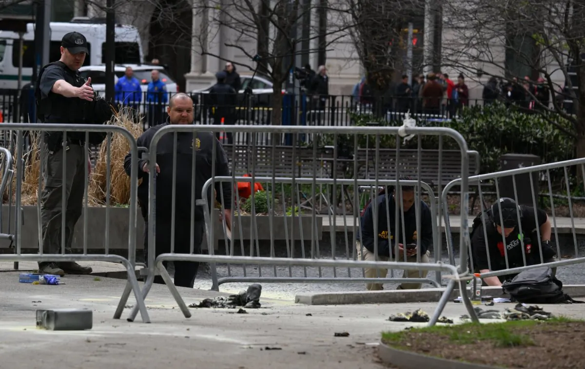 Investigators inspect the site at the park across from Manhattan Criminal Court in New York City after a man set himself on fire, in New York City, on April 19, 2024. (Angela Weiss/AFP/Getty Images)