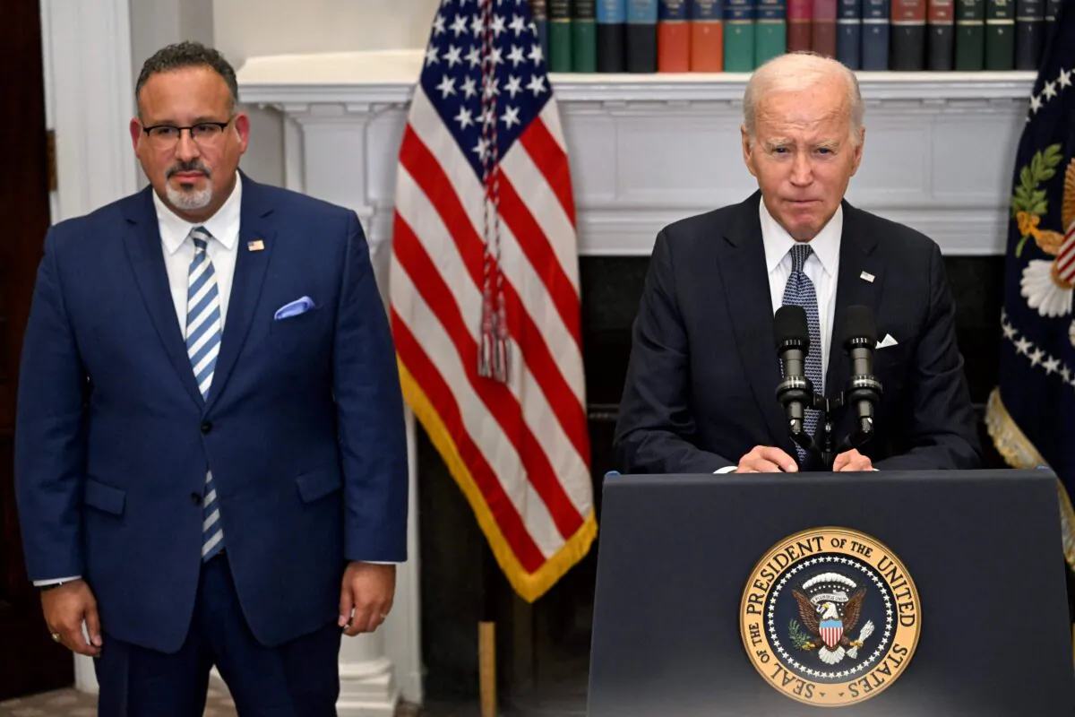 President Joe Biden speaks about the Supreme Court's decision overruling student debt forgiveness as Education Secretary Miguel Cardona looks on in the Roosevelt Room of the White House in Washington on June 30, 2023. (Jim Watson/AFP via Getty Images)