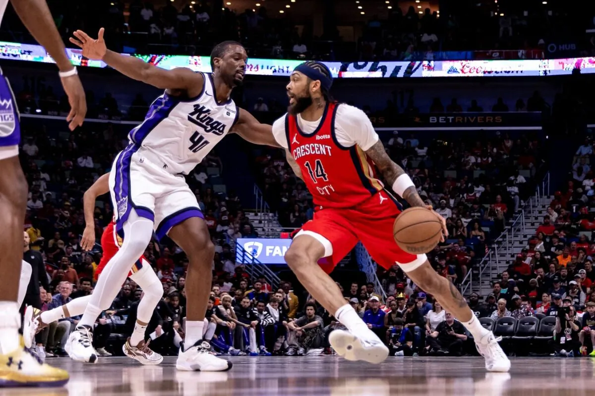 New Orleans Pelicans forward Brandon Ingram (14) dribbles against Sacramento Kings forward Harrison Barnes (40) in the first half during a play-in game of the 2024 NBA playoffs in New Orleans on April 19, 2024. (Stephen Lew/USA TODAY Sports via Field Level Media)