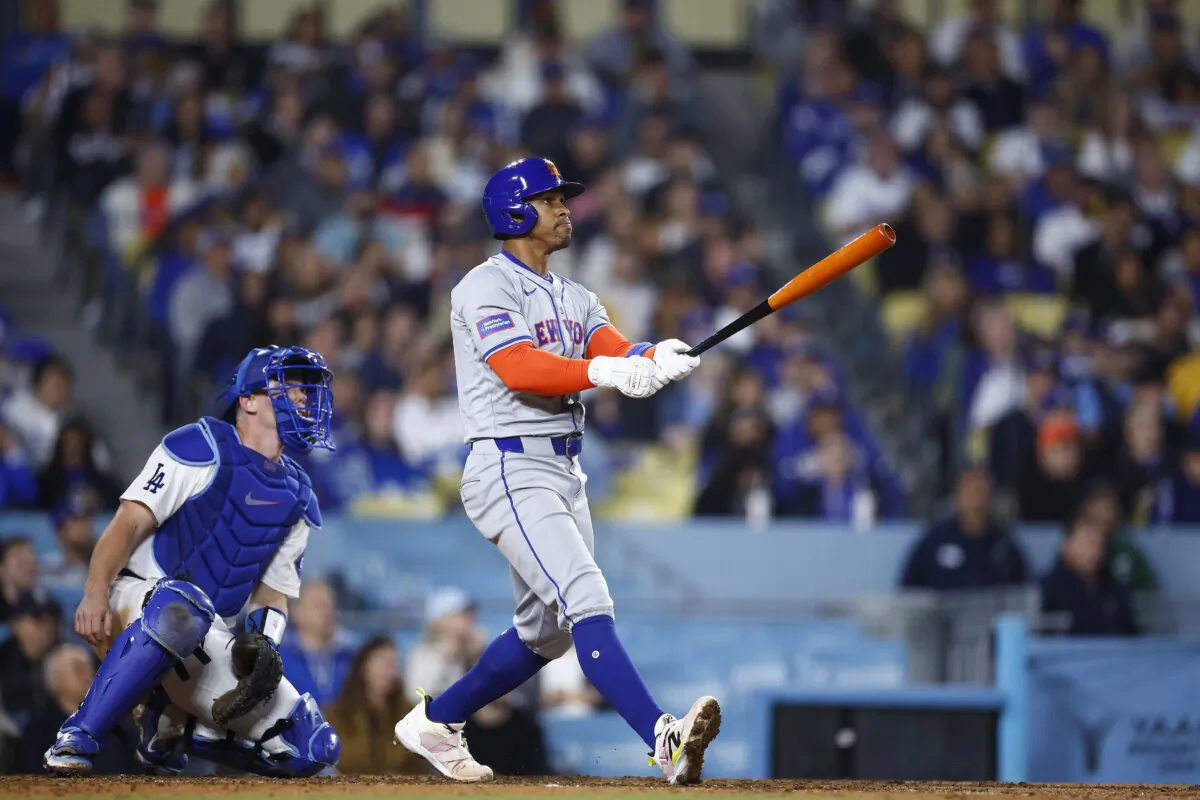 Francisco Lindor (12) of the New York Mets hits a two-run home run against the Los Angeles Dodgers in the seventh inning in Los Angeles on April 19, 2024. (Ronald Martinez/Getty Images)