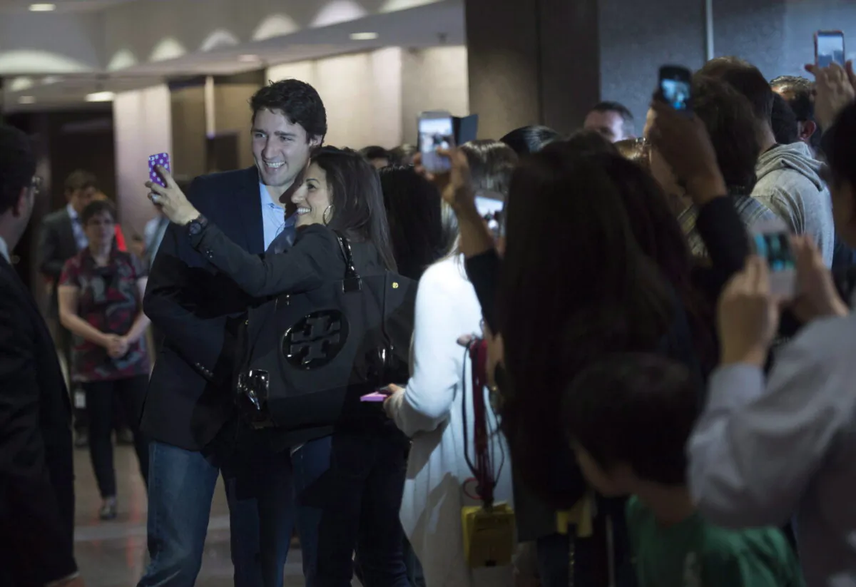 Prime Minister Justin Trudeau greets Department of Foreign Affairs staff who packed the lobby of the department’s headquarters in Ottawa on Nov. 6, 2015. (The Canadian Press/Sean Kilpatrick)