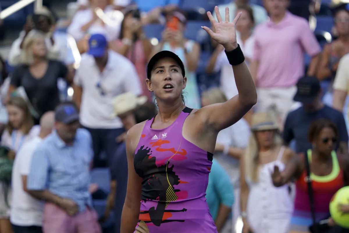 Garbiñe Muguruza of Spain waves to fans after defeating Linda Fruhvirtova of the Czech Republic during the second round of the U.S. Open tennis championships in New York on Sept. 1, 2022. (Seth Wenig/AP Photo)