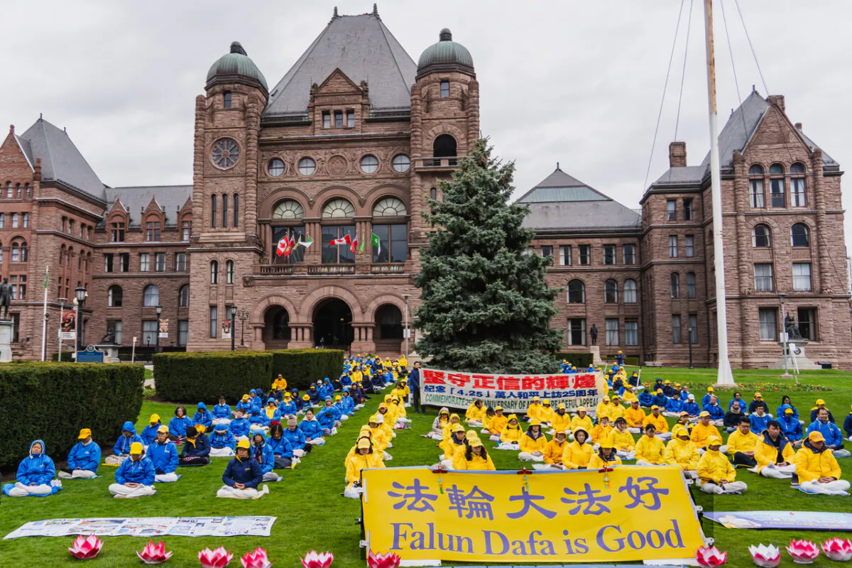 Hundreds of Falun Gong adherents gather on the grounds of the Ontario legislature in Toronto on April 20, 2024. The rally was held to condemn the Chinese Communist Party's 25 years of repression of the spiritual practice. (Jerry Zhang/The Epoch Times)