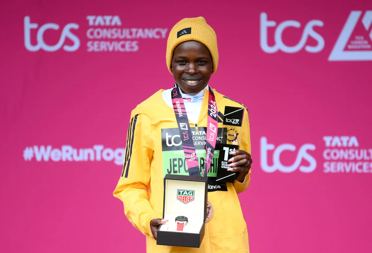 First placed Peres Jepchirchir of Kenya celebrate on the podium after winning the Women's elite race during the 2024 TCS London Marathon, in London, England, on April 21, 2024. (Alex Davidson/Getty Images)