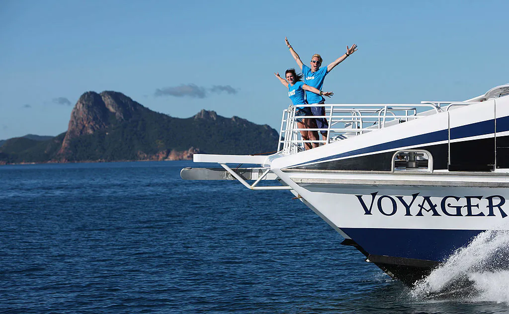 A couple pose on the Voyager boat on the Islands of the Great Barrier Reef in Hamilton Island in the Whitsundays, Australia, on July 1, 2009. (Eddie Safarik/Tourism Queensland via Getty Images)