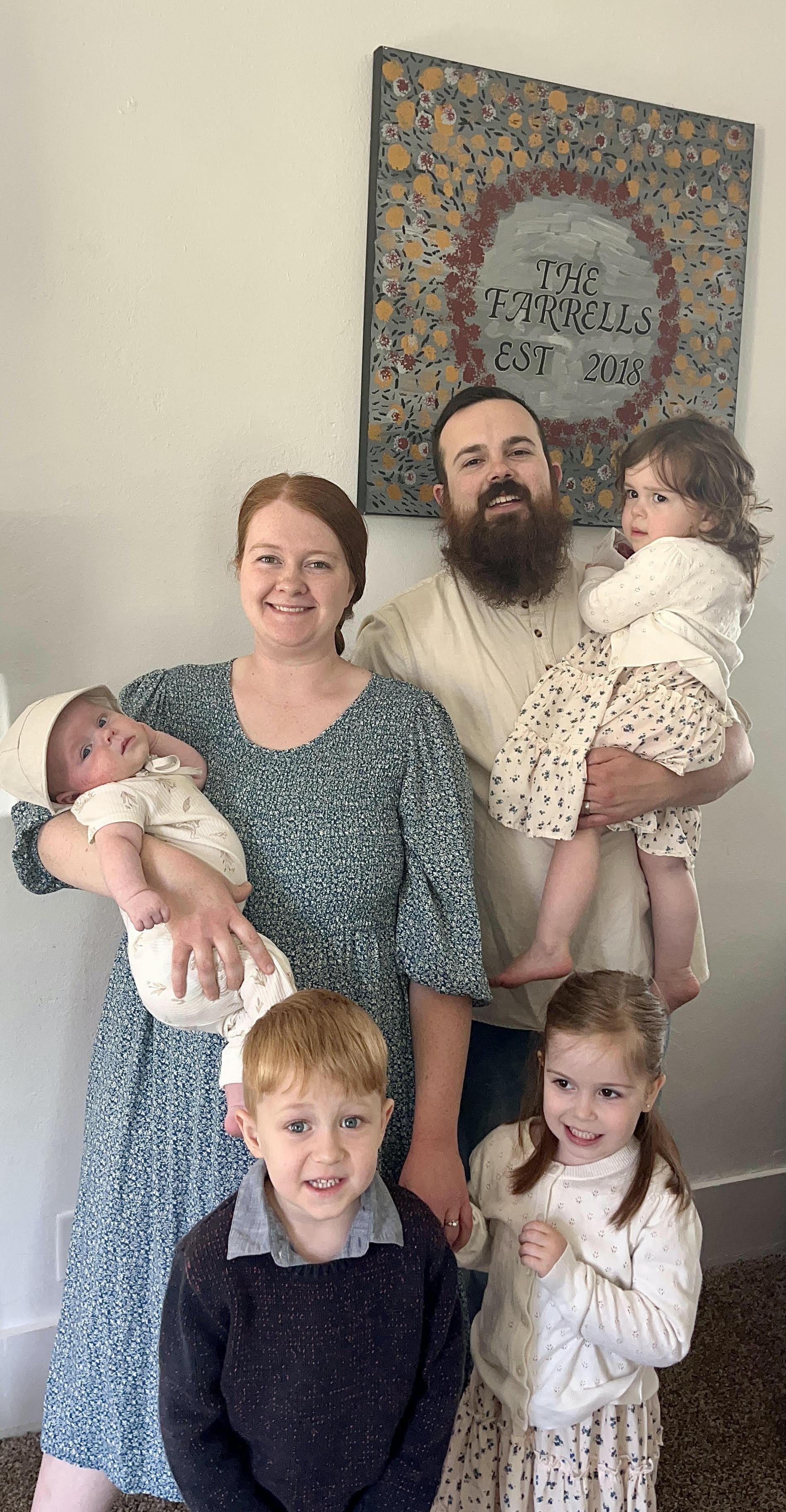 Mr. and Mrs. Farrell with their four kids.