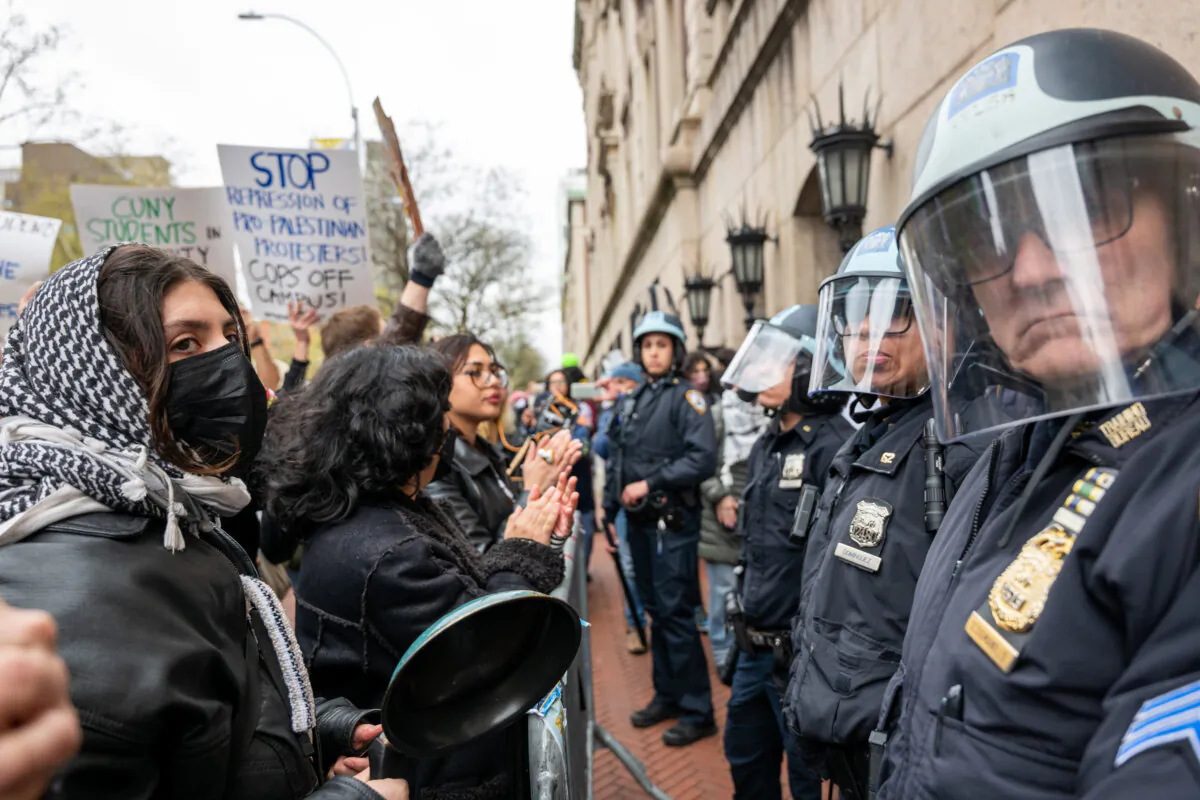 Students and pro-Palestinian activists face police as they gather outside of Columbia University to protest the university's stance on Israel, in New York City on April 18, 2024. (Spencer Platt/Getty Images)