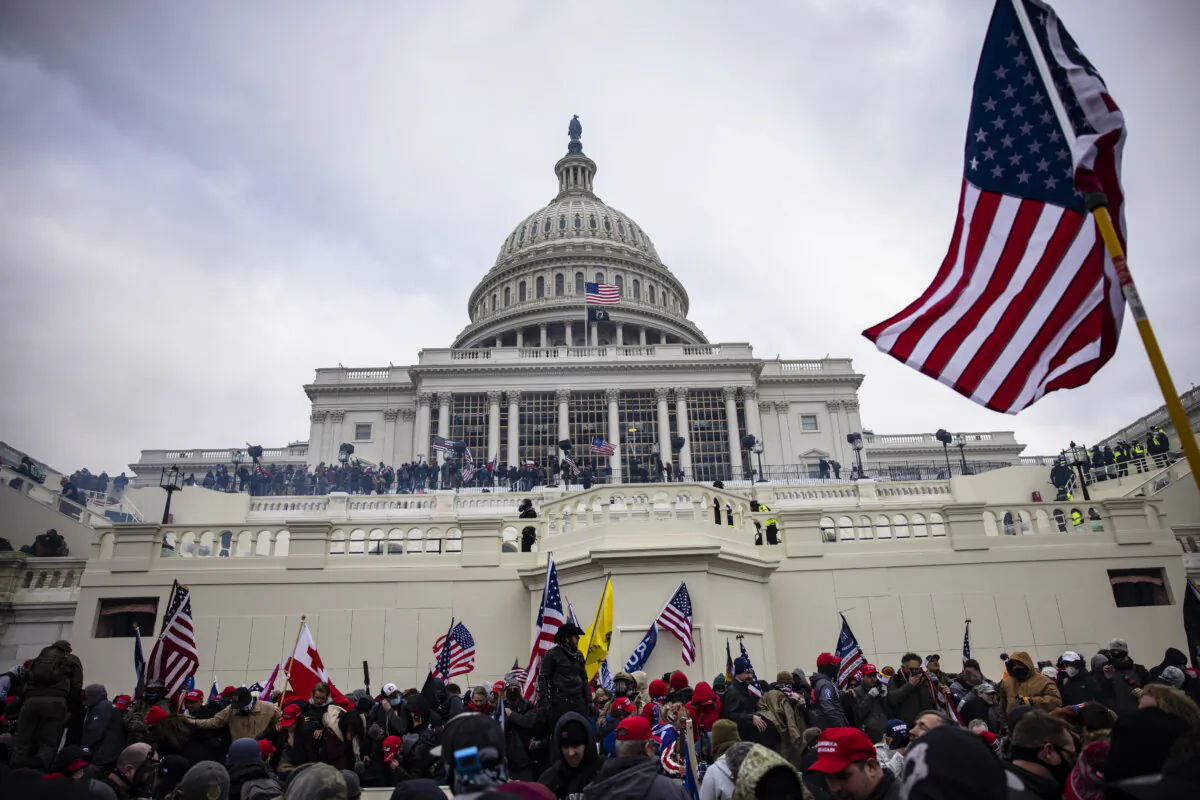 Trump supporters storm the U.S. Capitol following a rally with President Donald Trump on Jan. 6, 2021. (Samuel Corum/Getty Images)