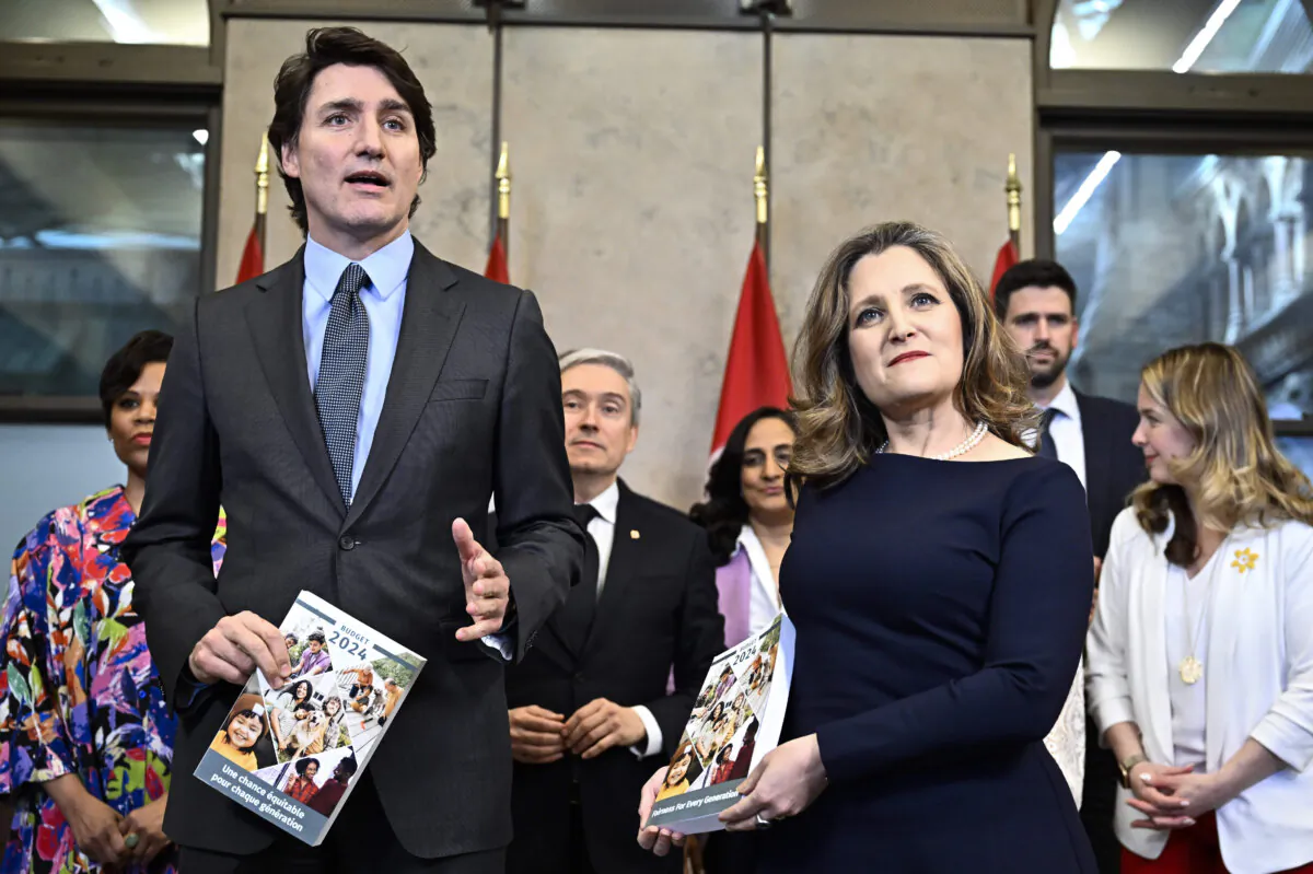 Prime Minister Justin Trudeau, Deputy Prime Minister and Minister of Finance Chrystia Freeland, and other cabinet ministers pose for a photo before the tabling of the federal budget on Parliament Hill in Ottawa on April 16, 2024. (The Canadian Press/Justin Tang)