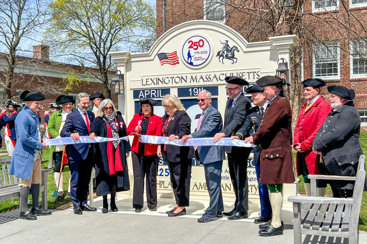 Government officials and VIPs cut a ribbon to commemorate the upcoming 250th anniversary of the Battle of Lexington, on April 19, 2024. (By Learner Liu/the Epoch Times) 