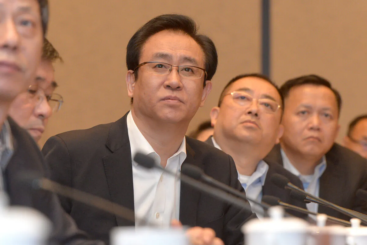 Evergrande President Xu Jiayin, also known as Hui Ka Yan in Cantonese, attending a meeting in Wuhan, central Hubei Province, China, on June 5, 2017. (STR/AFP via Getty Images)