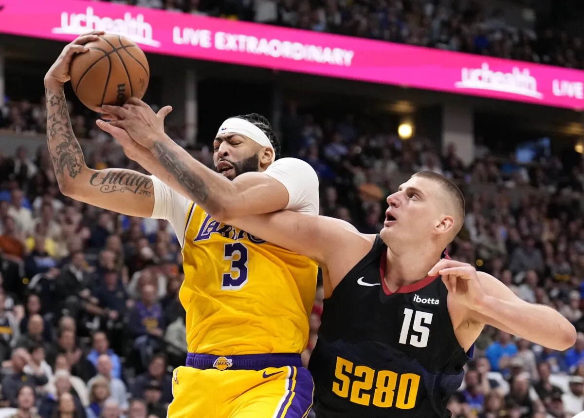 Los Angeles Lakers forward Anthony Davis (3) and Denver Nuggets center Nikola Jokic (15) battle for the ball during the first half in Game 2 of an NBA basketball first-round playoff series on in Denver on April 22, 2024. (Jack Dempsey/AP Photo)