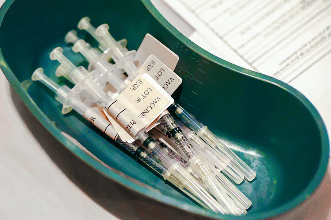 Syringes filled with COVID-19 vaccines sit on a table at a COVID-19 vaccination clinic in a file image. (Justin Sullivan/Getty Images)