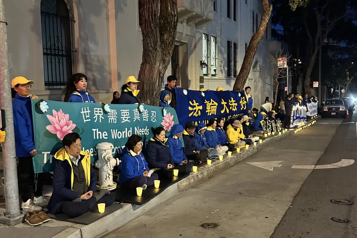 Falun Gong practitioners gather for a candlelight vigil in front of the Chinese Consulate in San Francisco on April 20, 2024. (Steve Ispas/The Epoch Times)