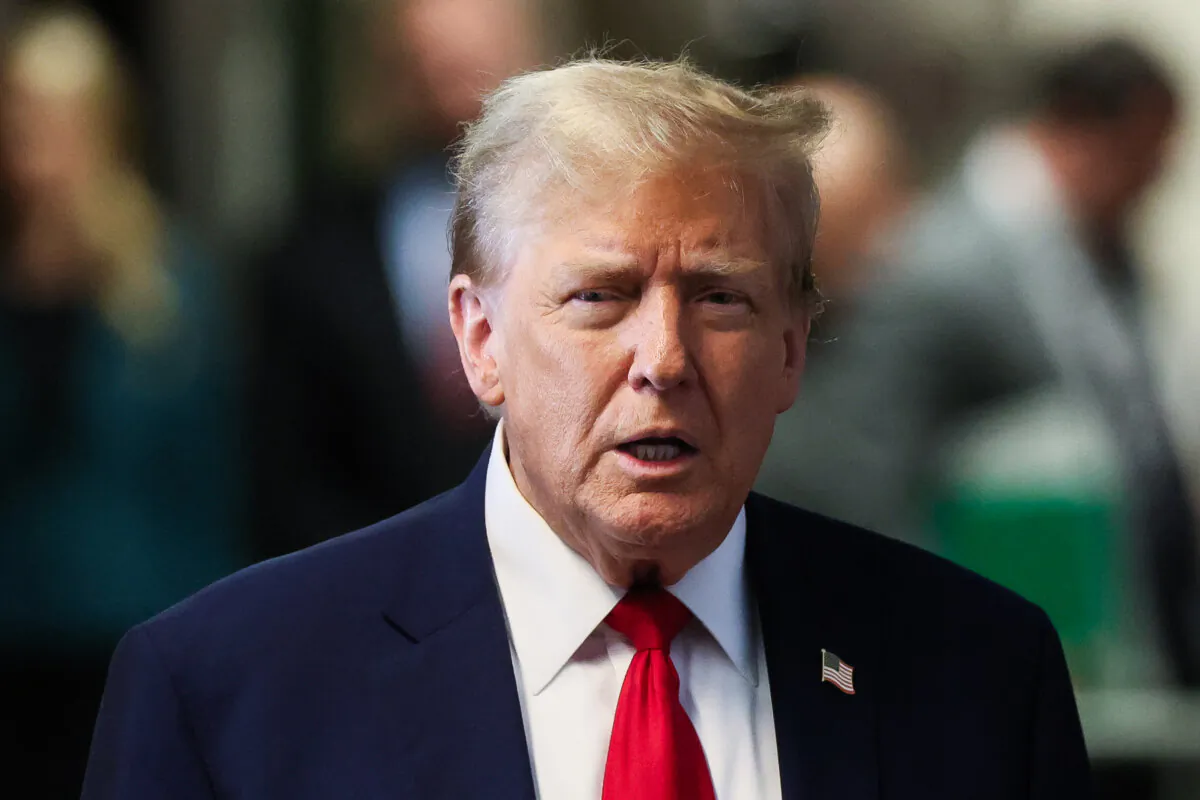 Former President Donald Trump speaks to the media as he arrives to court for his trial for allegedly covering up hush money payments at Manhattan Criminal Court in New York City, on April 23, 2024. (Brendan McDermid/Pool via Getty Images)