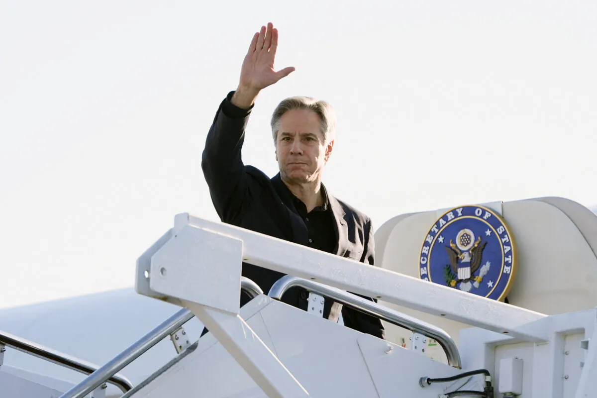 U.S. Secretary of State Antony Blinken waves as he boards his plane at Joint Base Andrews in Maryland, on April 23, 2024, on his way to Beijing. ( Mark Schiefelbein/POOL/AFP via Getty Images)