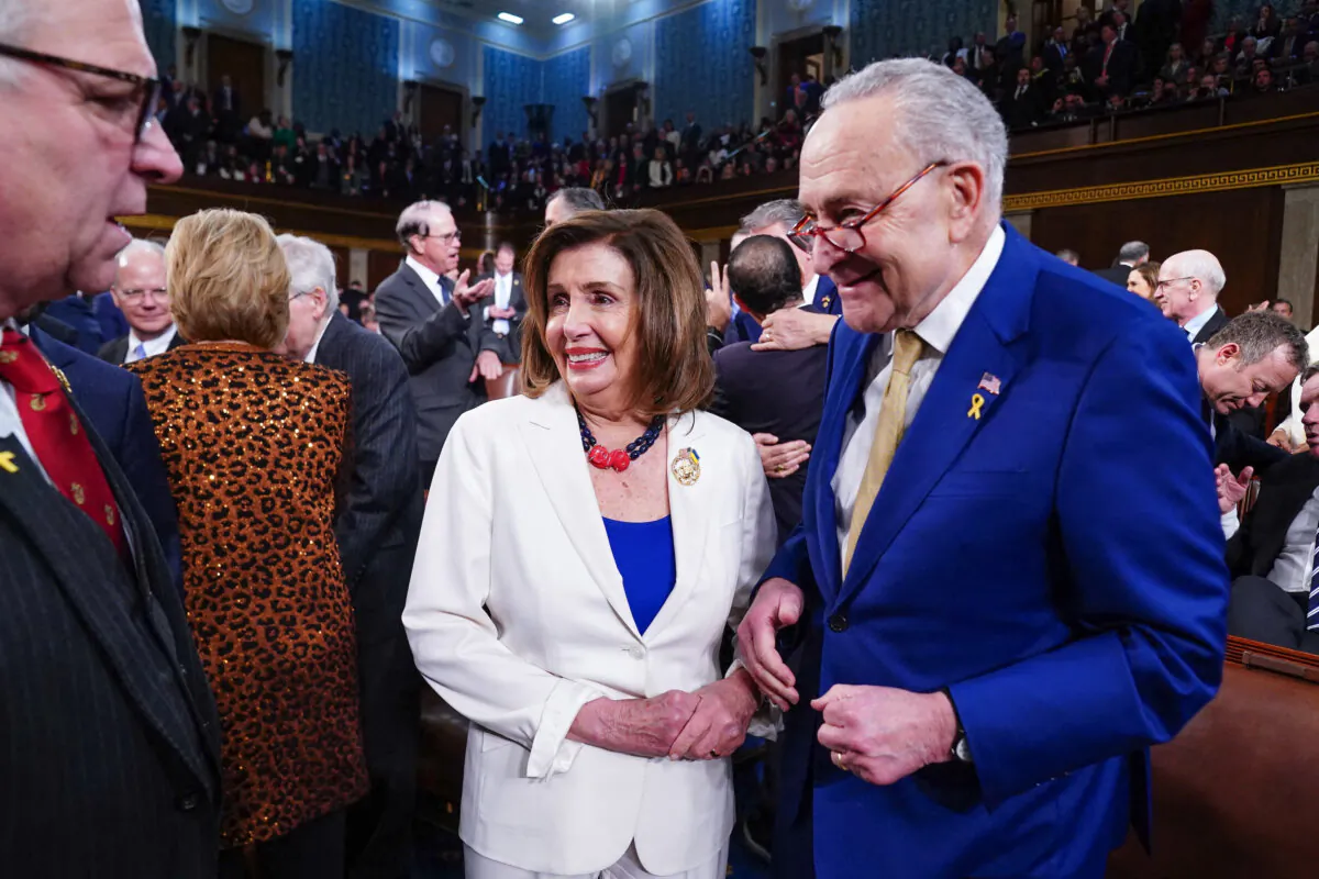 Senate Majority Leader Chuck Schumer (D-N.Y.) (R) chats with former House Speaker Rep. Nancy Pelosi (D-Calif.) C) before President Joe Biden's third State of the Union address to a joint session of Congress in the House Chamber of the US Capitol in Washington on March 7, 2024. (SHAWN THEW / POOL / AFP)