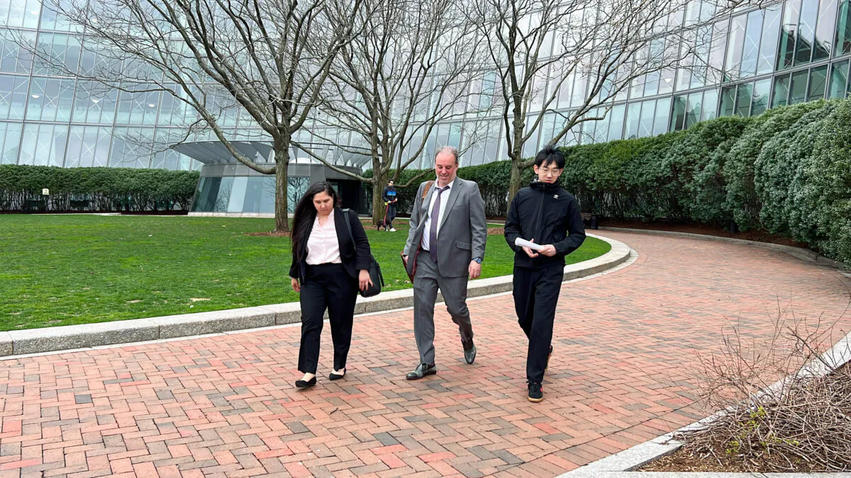 Wu Xiaolei (R) and his attorneys leave the United States District Court for the District of Massachusetts in Boston on April 24, 2024. (Learner Liu/The Epoch Times)