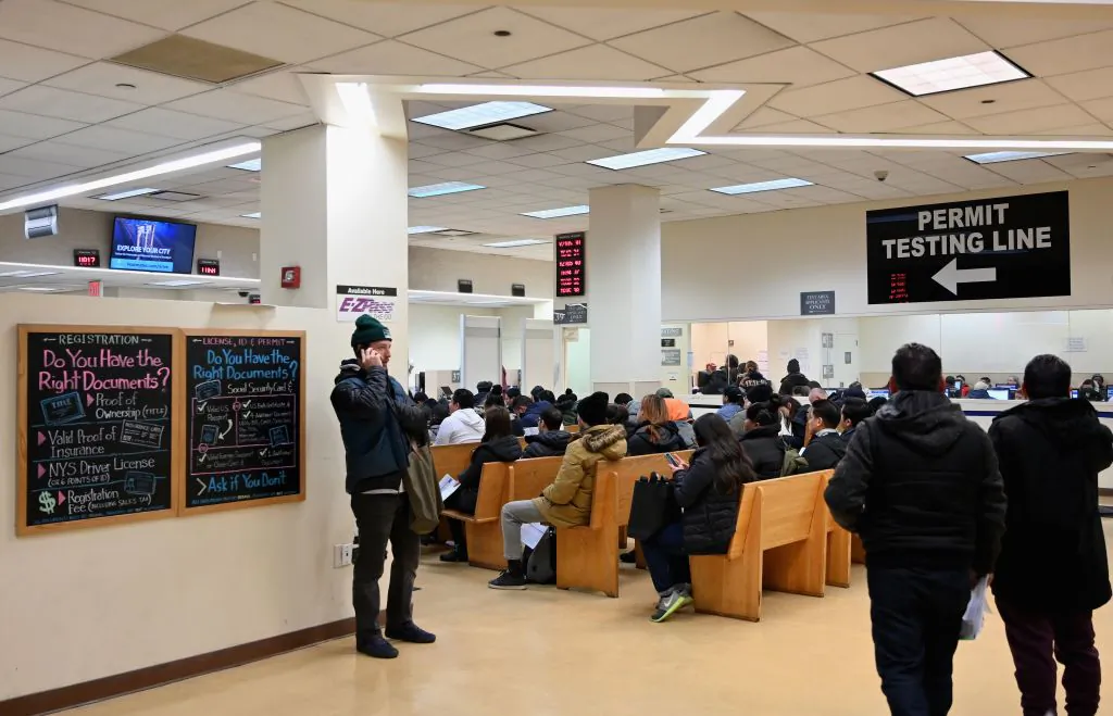 People wait at the New York State Department of Motor Vehicles (DMV) office at Atlantic Center in the Brooklyn borough of New York on Dec. 18, 2019. (Angela Weiss/AFP/Getty Images)
