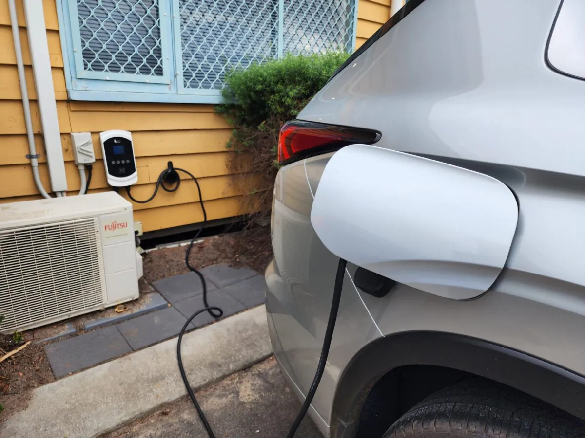 An electric vehicle is plugged in at a workplace in Western Australia on April 23, 2024. (Susan Mortimer/The Epoch Times)