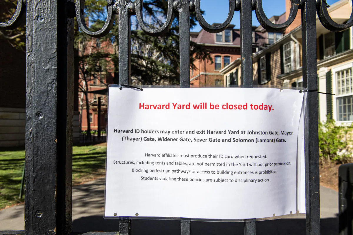 A sign is seen on a gate to Harvard University to prevent encampments from being set up on their property in Cambridge, Mass., on April 22, 2024, as protests against Israel's military campaign against Hamas in Gaza grow on university campuses. (JOSEPH PREZIOSO/AFP via Getty Images)