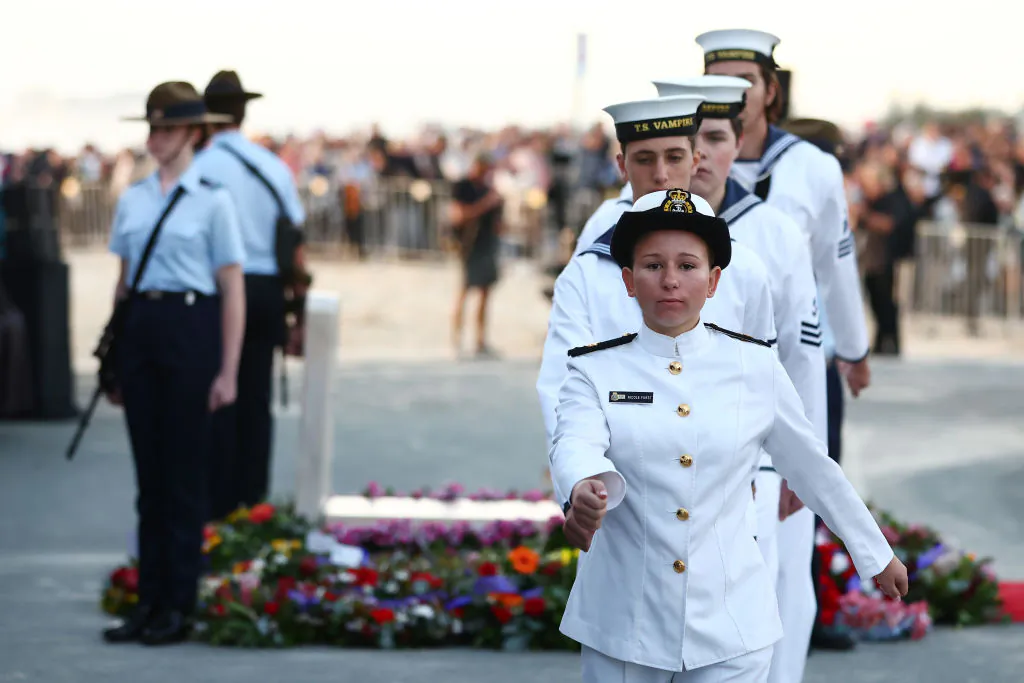 Service personnel take part in the ANZAC dawn service in Currumbin, Australia, on April 25, 2024. (Photo by Chris Hyde/Getty Images)