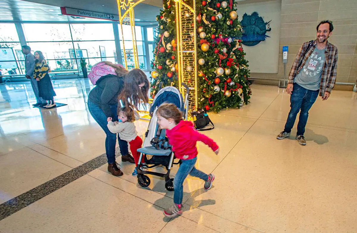 The Millericks drove from Lubbock to Dallas to make their flight to Orlando, Florida, a few days after Christmas in 2022, after frigid weather forced the cancellation of their original flight. From left: Kay, 18-month-old Isla, 4-year-old Mara and Sean. (David Montesino/Fort Worth Star Telegram/TNS)