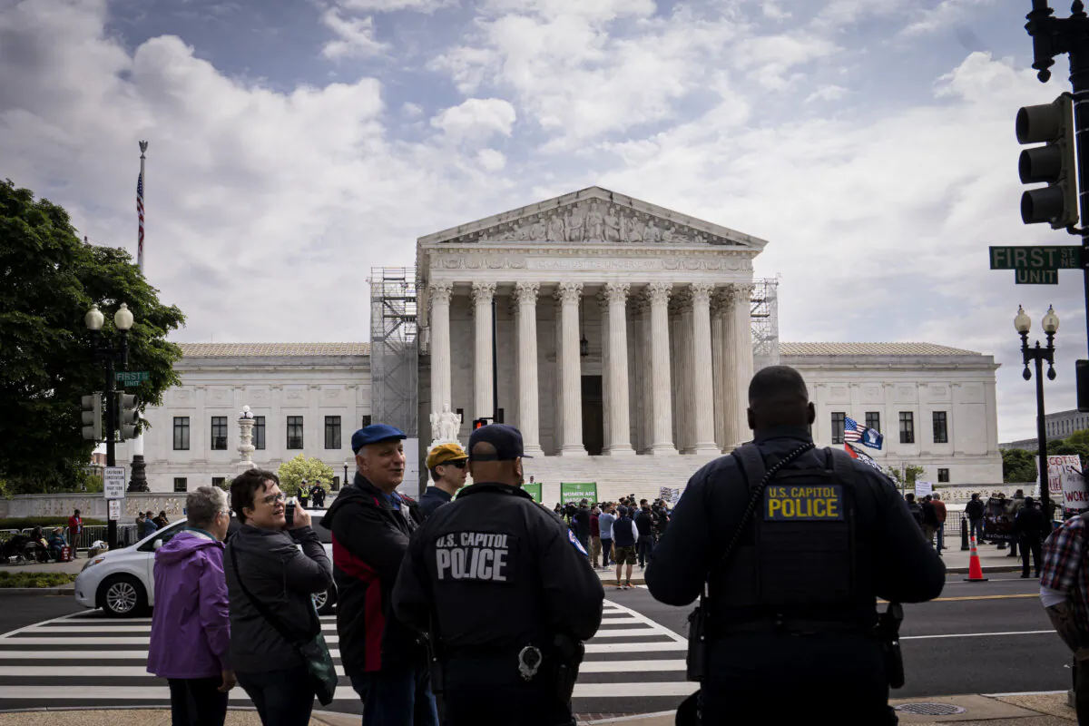 Protestors in front of the Supreme Court in Washington on April 25, 2024. (Madalina Vasiliu/The Epoch Times)