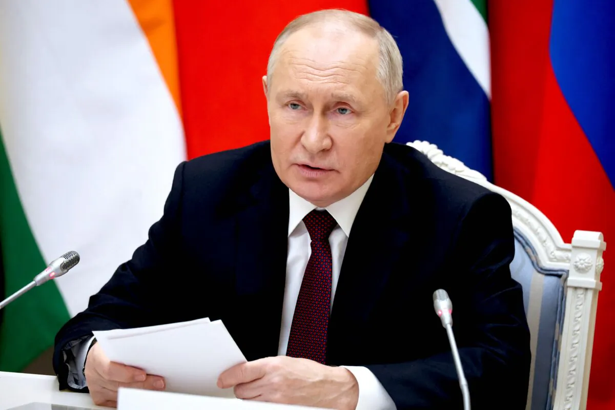 Russia's President Vladimir Putin attends a virtual summit of the BRICS group of nations (the bloc that includes Brazil, Russia, India, China and South Africa) to discuss the Israel-Hamas war, in Moscow on Nov. 21, 2023. (Alexander Kazakov/Pool/AFP via Getty Images)